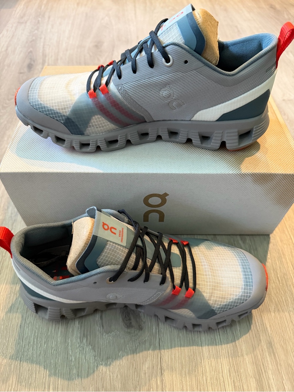 On Running Women’s Grey Athletic Sneakers with Red Accents